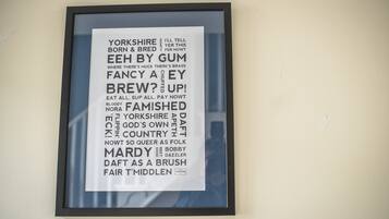 A framed text poster with a list of words and phrases.