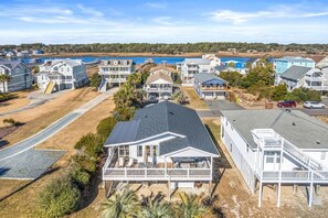 A residential area with houses, a dock, and a body of water.