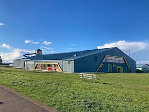 A large industrial building with a prominent tower and a smaller attached structure. - New | Family Haven | Walk to Rossnowlagh Beach | Large Garden | Sauna (Rossnowlagh Lower)