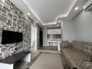 Appartement Standard | Coin séjour | Télévision à écran plat