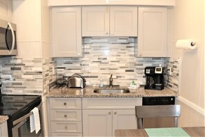 Fridge, coffee/tea maker, cookware/dishes/utensils