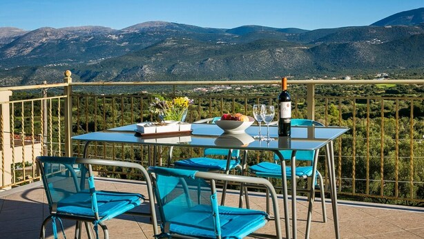 A table set outdoors with a view of mountains. - Belle Helens Villa Kefalonia (Kefalonia)