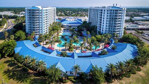 Surrounded by lush greenery and palm trees, this hotel offers a tranquil atmosphere and expansive views from its multiple balconies.