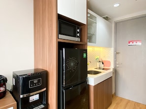Studio | Private kitchen - Warm And Cozy Studio At Vasanta Innopark Apartment (Cikarang)