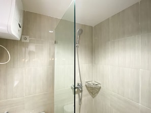 Studio | Bathroom | Shower, towels, soap, shampoo - Warm And Cozy Studio At Vasanta Innopark Apartment (Cikarang)