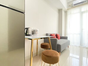 Apartment | Living area - Cozy Stay 1Br At Vasanta Innopark Apartment (Cikarang)