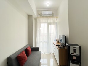 Apartment | Living area - Cozy Stay 1Br At Vasanta Innopark Apartment (Cikarang)