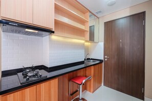 Studio | Private kitchen | Full-size fridge, stovetop - Nice And Fancy Studio At Transpark Cibubur Apartment (Depok)