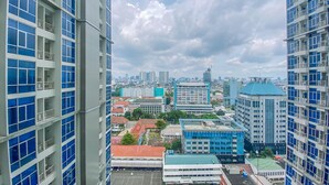 A high-rise building with multiple balconies and a view of a cityscape. - Best Location 2Br Apartment At Capitol Park Residence (Jakarta)