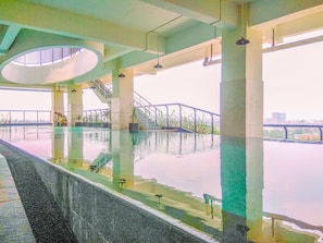 Outdoor pool - Comfortable Studio Apartment At Atlanta Residences (Depok)