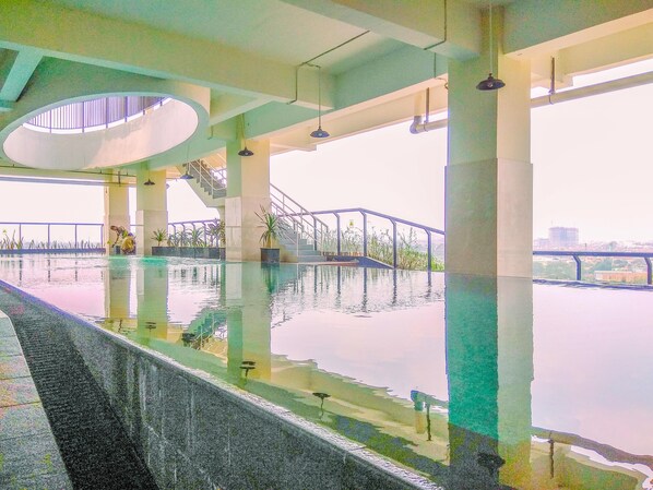 Outdoor pool - Comfortable Studio Apartment At Atlanta Residences (Depok)