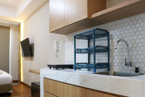 Studio | Private kitchen | Full-size fridge, stovetop - Cozy Stay Studio Room At Tokyo Riverside Pik 2 Apartment (Teluknaga)