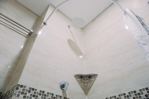 Studio | Bathroom | Shower, towels, soap, shampoo - Homey And Comfy Stay Studio Apartment At B Residence (Pagedangan)