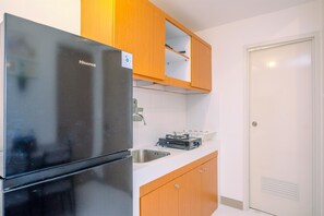 Appartamento | Cucina privata | Frigorifero, piano cottura, risottiera, tavolo da pranzo
