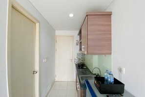 Apartment | Private kitchen - Simply Look 1Br With Extra Room Patraland Urbano Apartment (Bekasi)