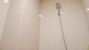 A shower with a round head and a long hose. - Nice And Elegant Studio At Vasaka Solterra Apartment (Jakarta)