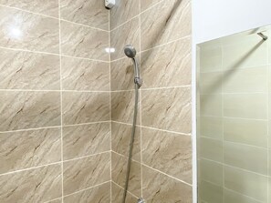 Studio | Bathroom | Shower, towels, soap, shampoo - Minimalist And Homey Studio At Transpark Juanda Bekasi Timur Apartment (Bekasi)