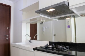 Studio | Private kitchen - Homey And Nice Studio At Signature Park Grande Apartment (Jakarta)