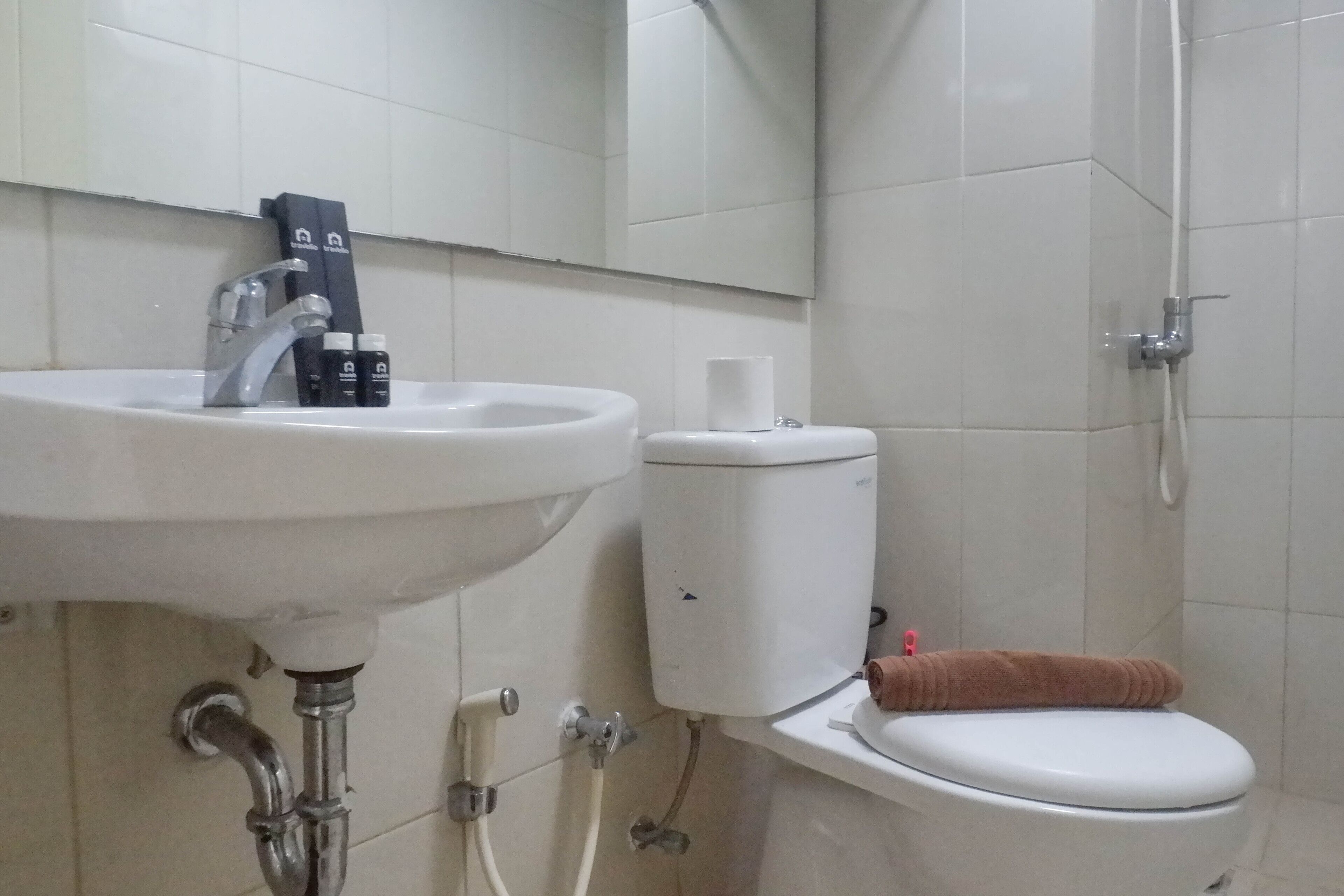 A bathroom with a sink, toilet, and shower.