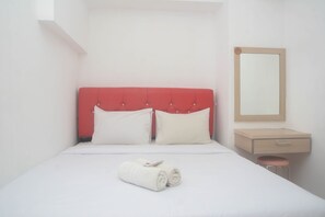 Simple, functional room with a single bed, nightstand, and stool.