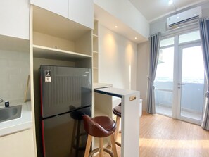 Studio | Private kitchen | Fridge, stovetop, rice cooker, dining tables