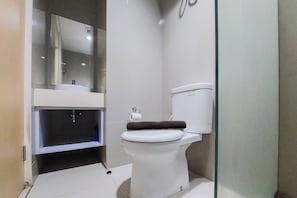 Studio | Bathroom | Shower, towels, soap, shampoo - Simply Look And Comfort Studio Tree Park City Bsd Apartment (South Tangerang)