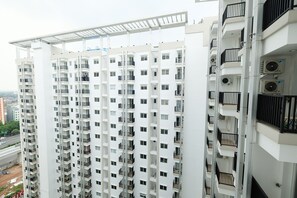 Stylish high-rise building with spacious balconies and modern design.