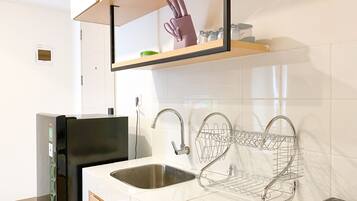 Apartment | Private kitchen | Fridge, stovetop, rice cooker, dining tables
