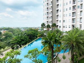 Outdoor pool - Good And Homey 1Br Apartment At Mustika Golf Residence (Cikarang)