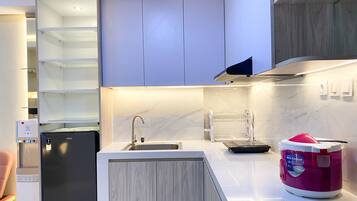 Apartment | Private kitchen | Fridge, stovetop, rice cooker, dining tables