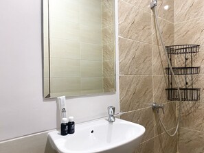 Studio | Bathroom | Shower, free toiletries, towels, soap - Serene Designed Studio Transpark Juanda Bekasi Timur Apartment (Bekasi)