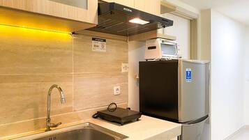 Apartment | Private kitchen | Fridge, stovetop, rice cooker, dining tables