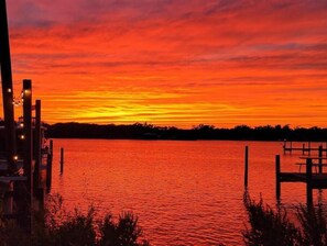Enjoy serene waterfront views and a tranquil atmosphere by the calm body of water.