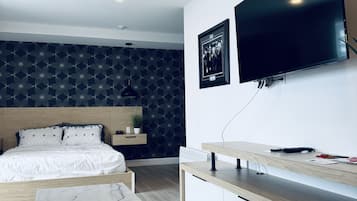 Habitación individual superior | Cortinas blackout, insonorización y tabla de planchar con plancha