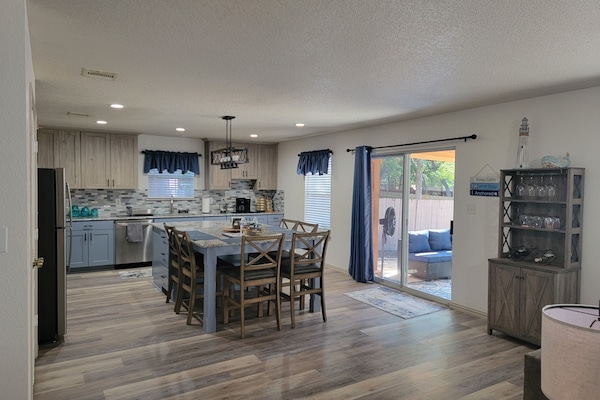Sliding glass door to backyard seating and grilling area.