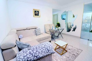 Luxury Apartment | Living area | 24-inch Smart TV with digital channels