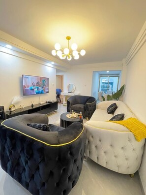 Business Apartment | Living area | 24-inch Smart TV with digital channels - Lux Suites Goldpark  Homes Kilimani (Nairobi)