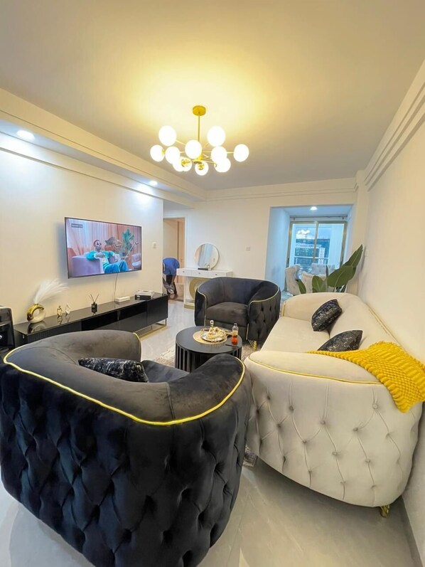 Business Apartment | Living area | 24-inch Smart TV with digital channels - Lux Suites Goldpark Homes Kilimani (Nairobi)