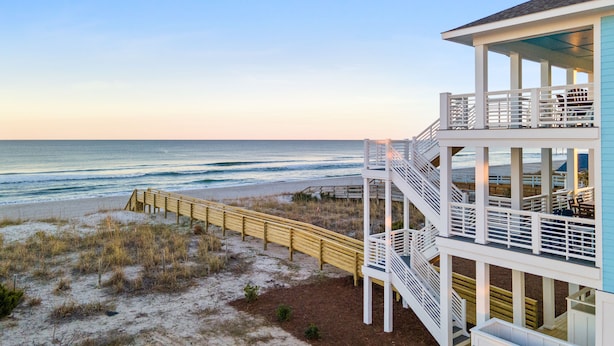 A beachfront property with a multi-level balcony overlooking the ocean. - Enjoy AMAZING VIEWS at almost new spacious oceanfront unit, huge deck, elevator (Carolina Beach)
