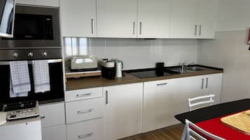 Apartment, Private Bathroom, Sea View (2nd Floor) | Private kitchen | Fridge, microwave, espresso maker, electric kettle