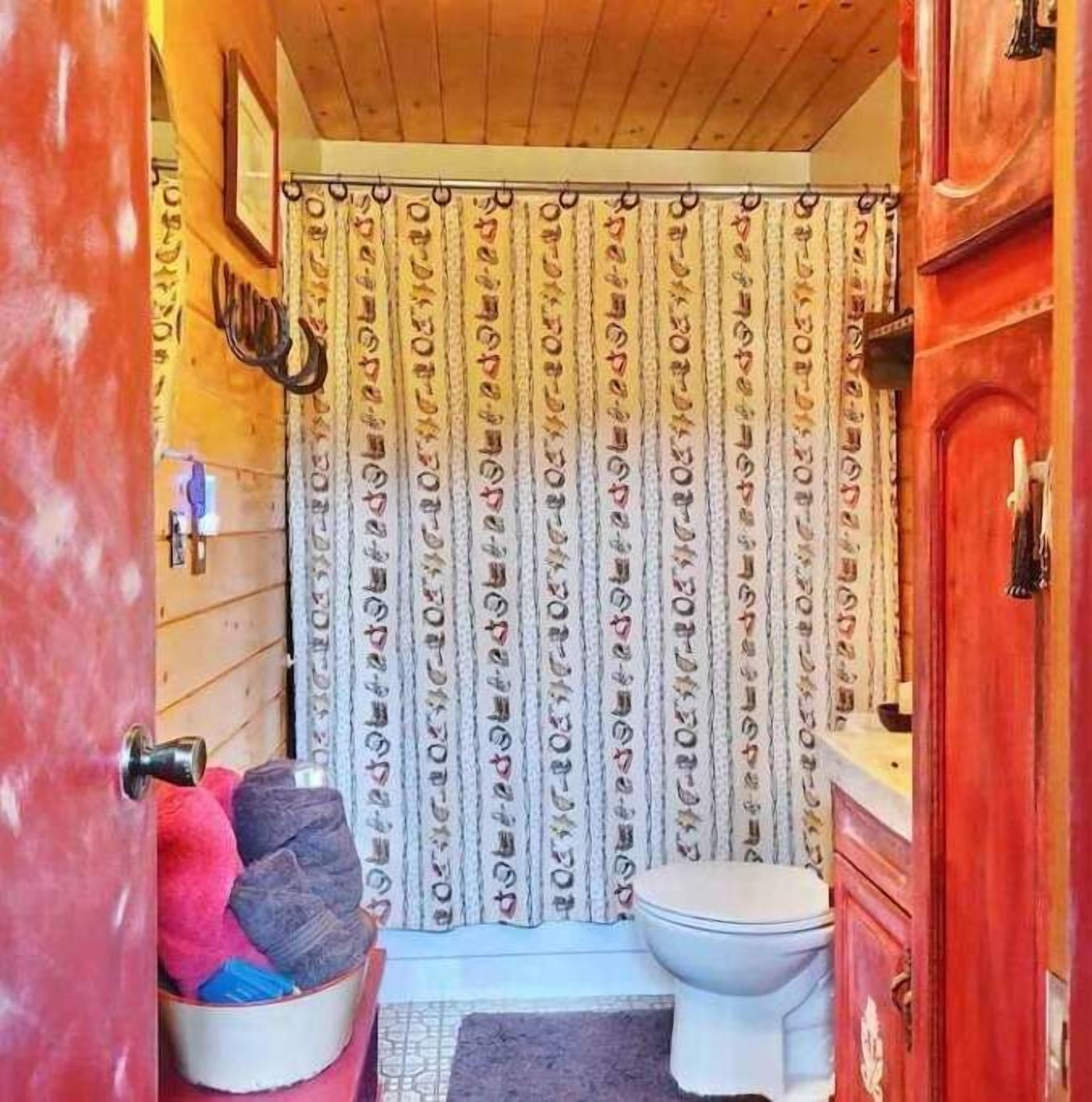Full bathroom off of the living room and under the loft.