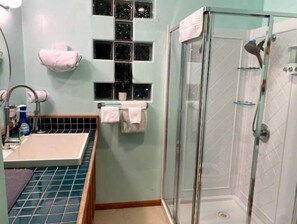 Shower, hair dryer, towels, soap