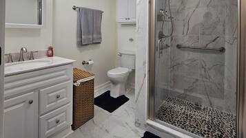 Shower, hair dryer, towels, soap