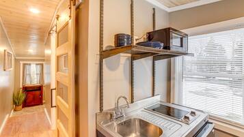 Fridge, microwave, coffee/tea maker, cookware/dishes/utensils