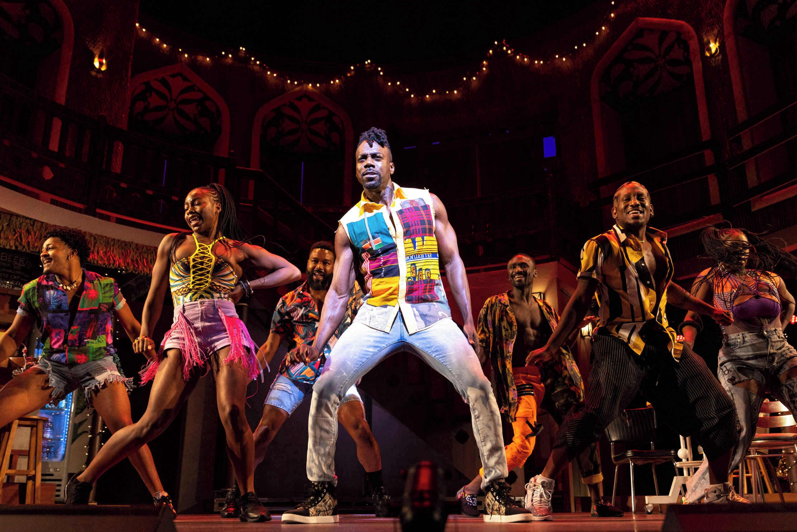 A stage with performers in colorful costumes.