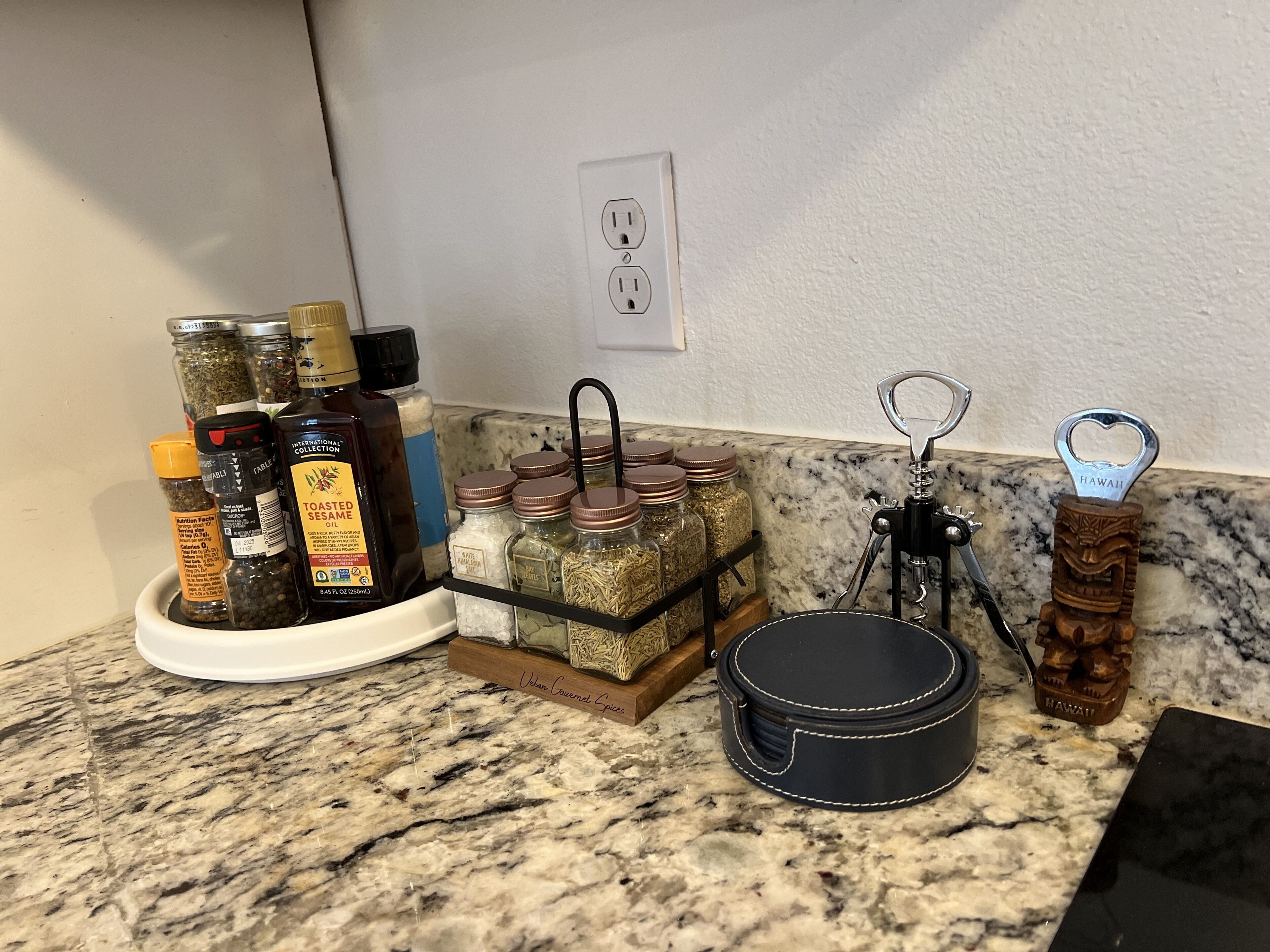 A kitchen counter with various food items, a wine opener, and a black pot.