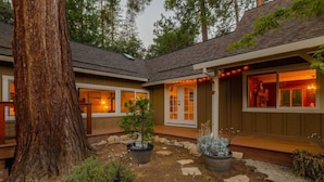 A house with a large tree, potted plants, and a stone pathway. - Private Villa W/ Pool/spa, GameBarn, 4300 sq ft- Perfect for families and large groups (Twain Harte)
