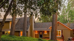 A row of houses with a central building featuring a porch and a door. - Private Villa W/ Pool/spa, GameBarn, 4300 sq ft- Perfect for families and large groups (Twain Harte)