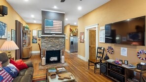 Smart TV, fireplace, books, stereo