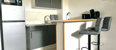 Fridge, microwave, stovetop, coffee/tea maker